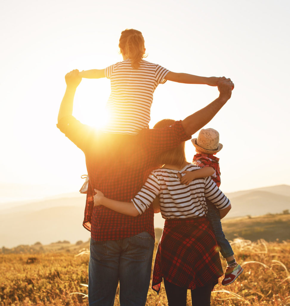 family looking at sunrise