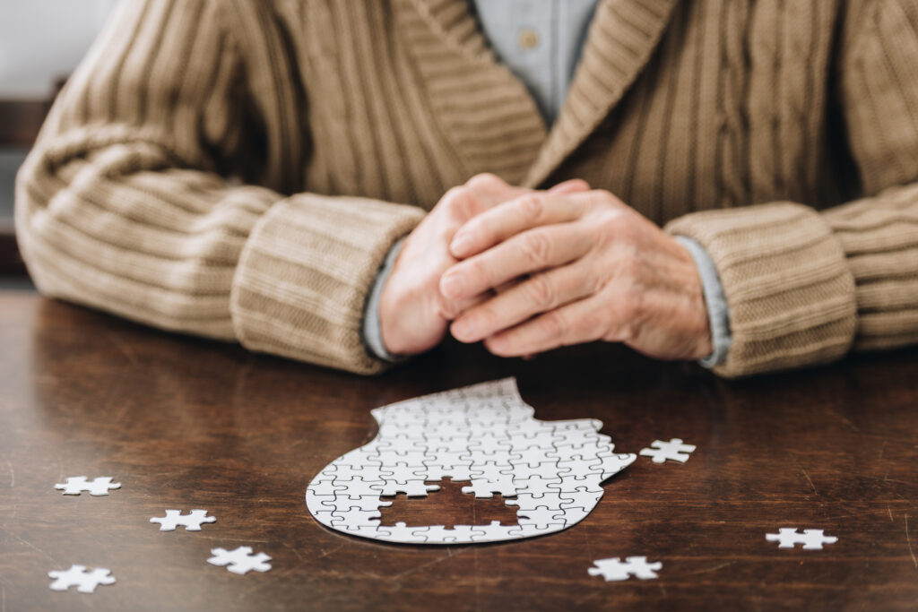 senior with dementia working a puzzel